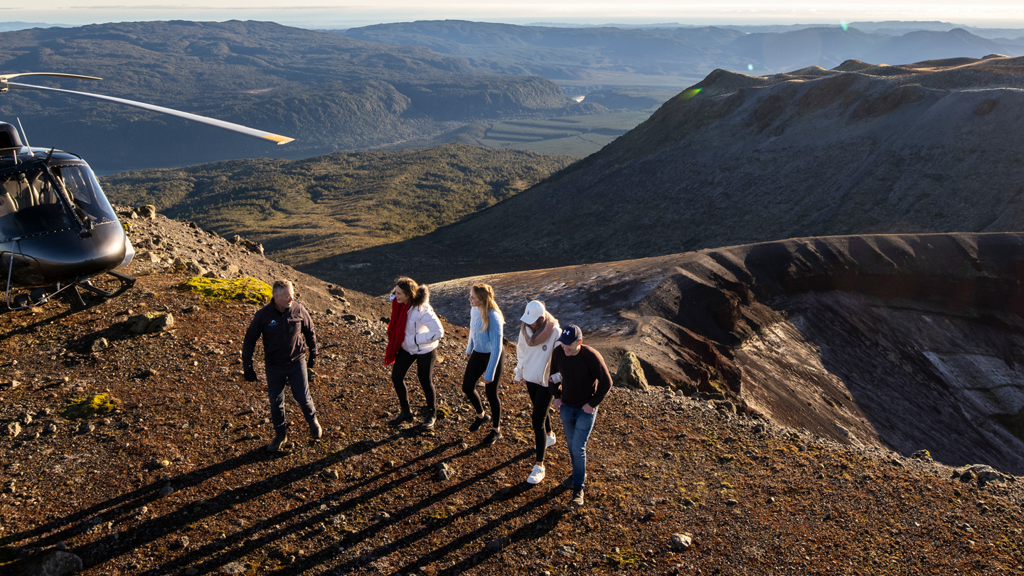 People walking along the top of the mt tarawera crater