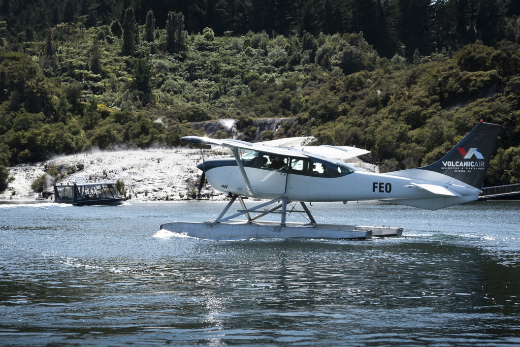 Cessna C 206 on River with Oki in Background