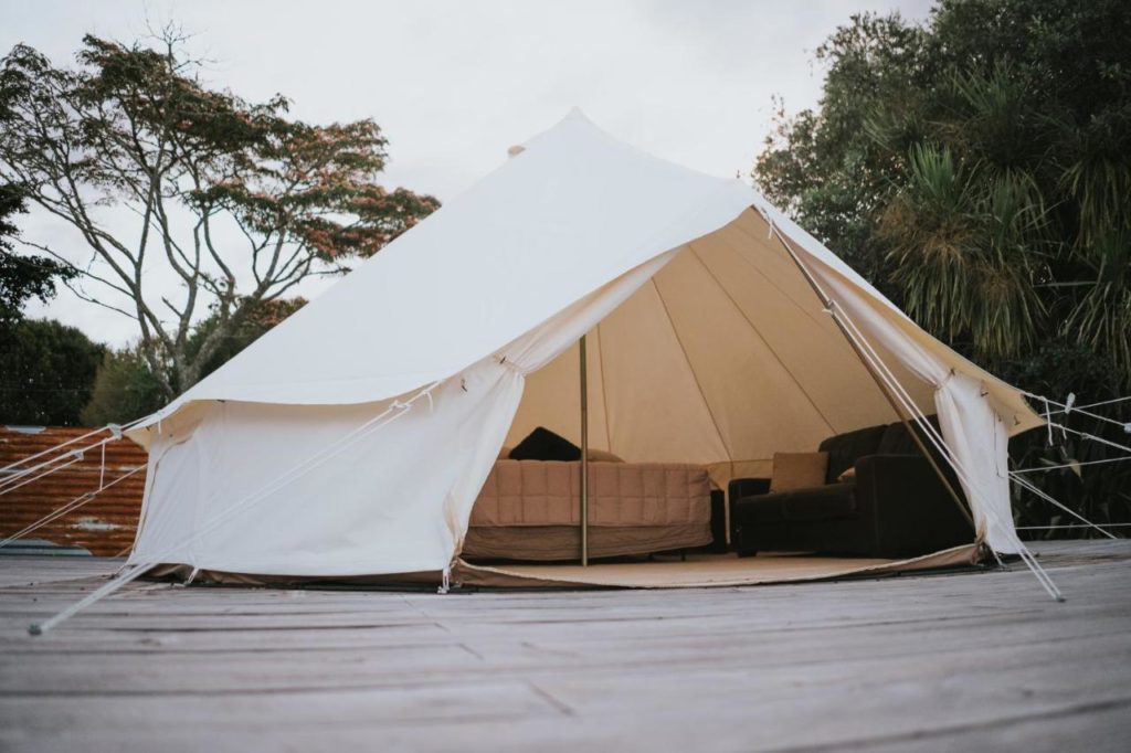 A glamping tent on a wooden deck