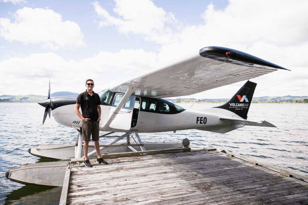 Pilot standing beside Cessna 206 floatplane