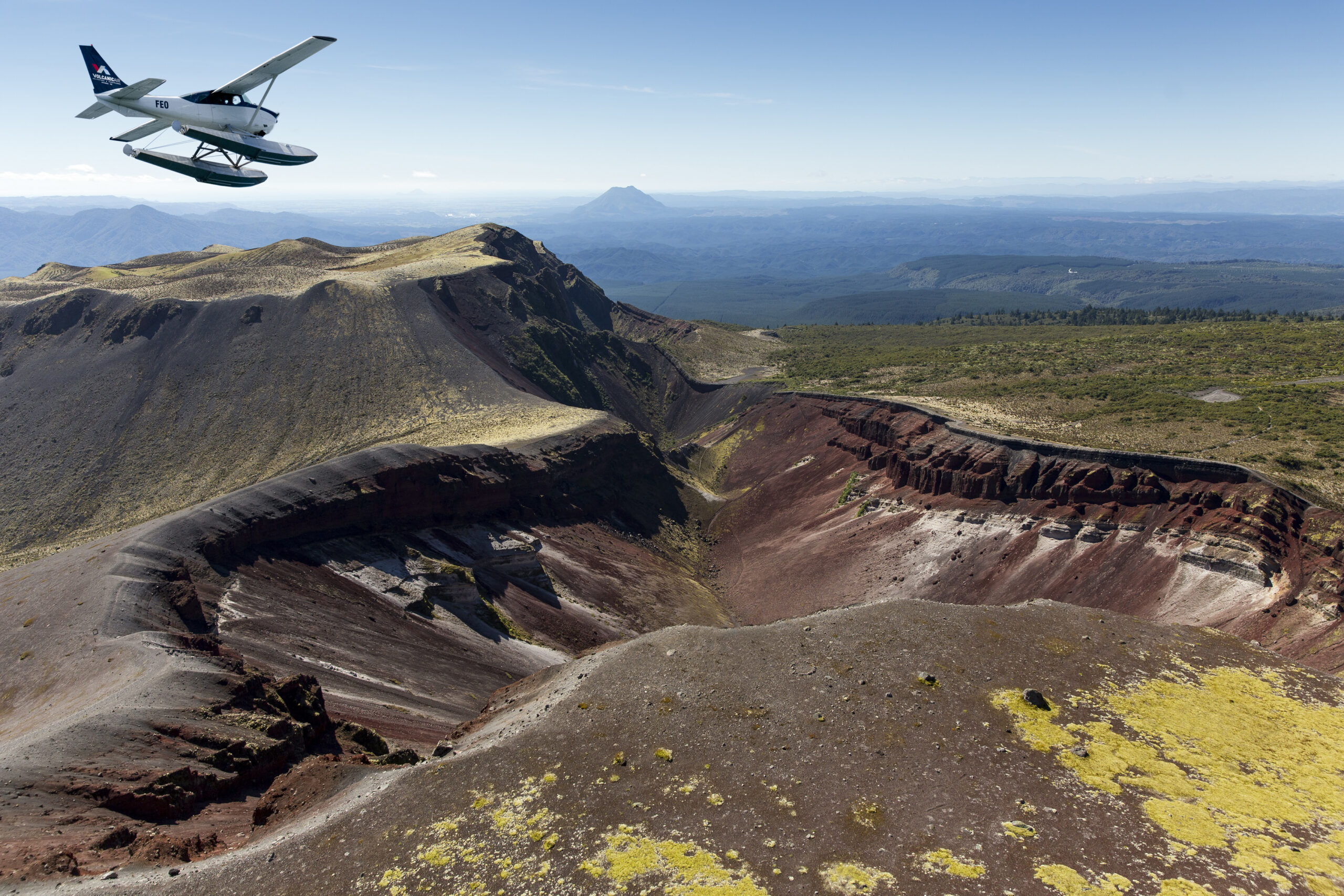 Cessna flying over Mount Tarawera Craters