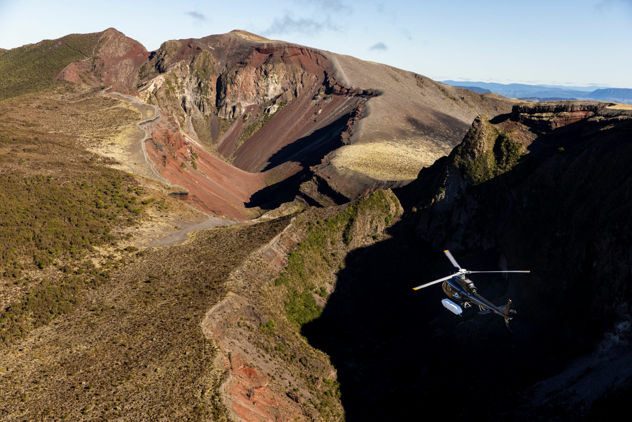 Helicopter flying through Mt Tarawera craters